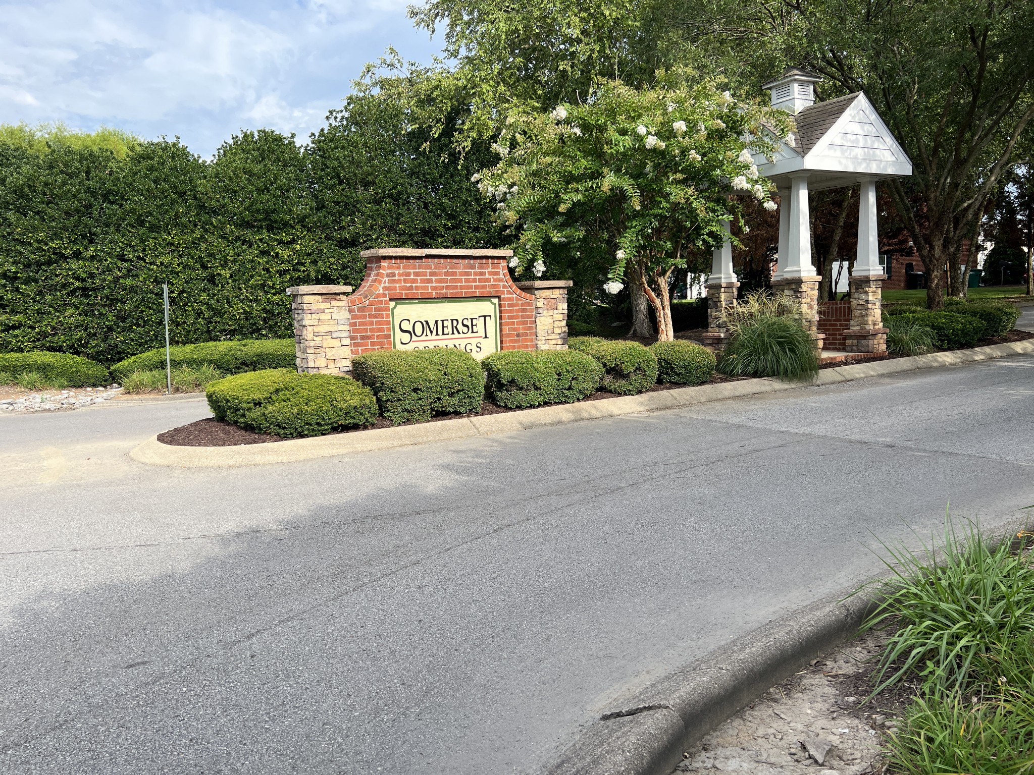 1040 Wells Way Spring Hill, TN 37174 - Photo 24 of 36 a front view of a house with a yard and garage