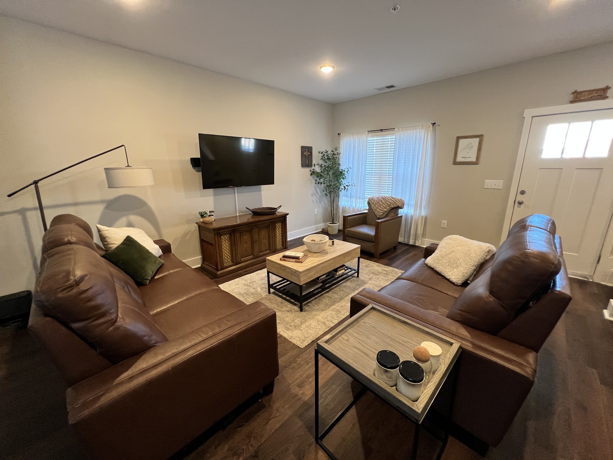 1040 Wells Way Spring Hill, TN 37174 - Photo 5 of 36 a living room with furniture and a flat screen tv