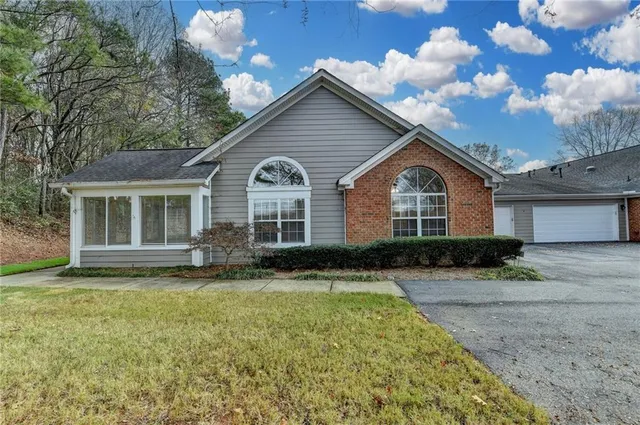 a view of a house with a yard