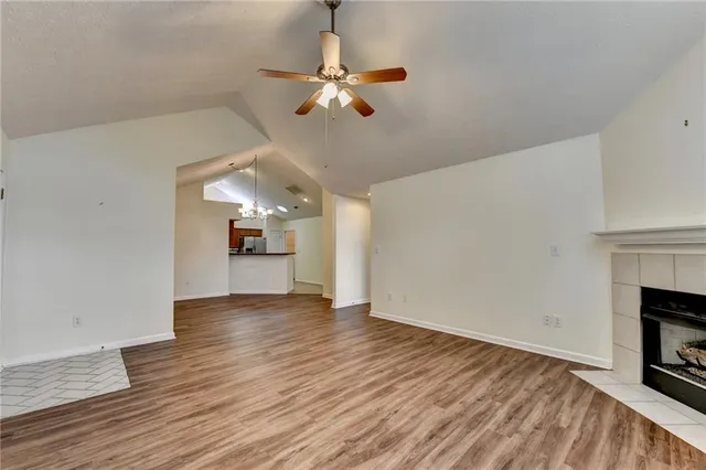 a kitchen with stainless steel appliances granite countertop a stove a microwave and a refrigerator