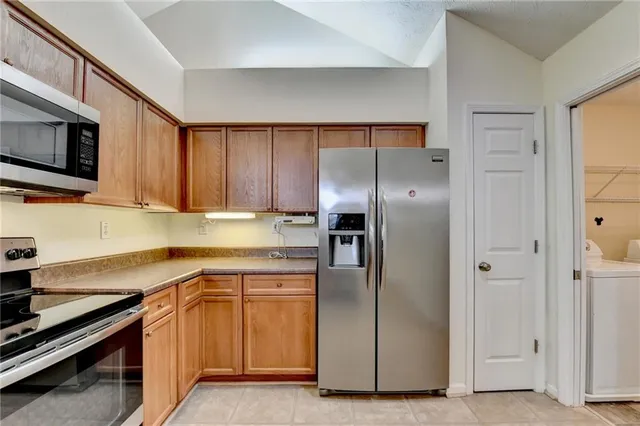a view of a room with wooden floor and window