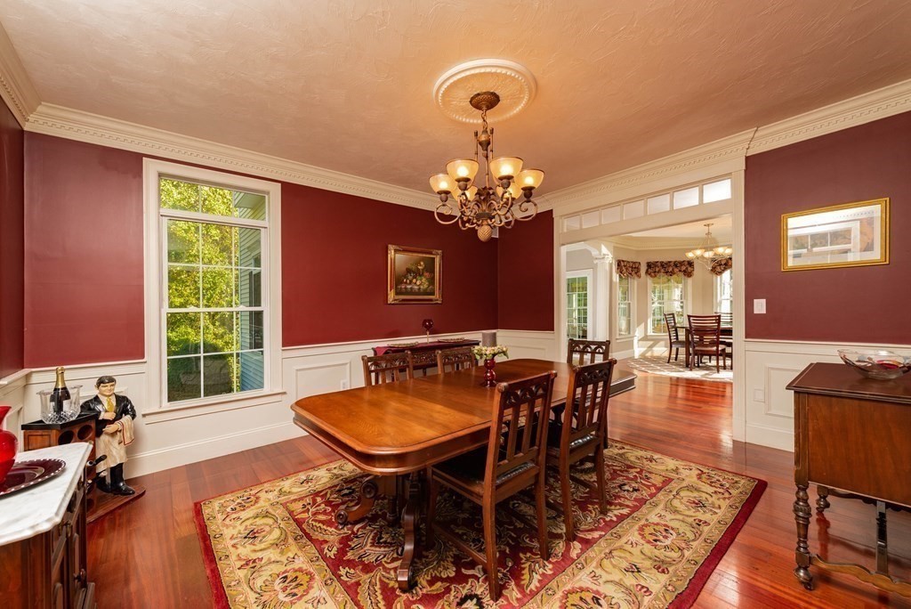 63 Bridge Street Raynham, MA 02767 - Photo 11 of 38 a view of a dining room with furniture and chandelier