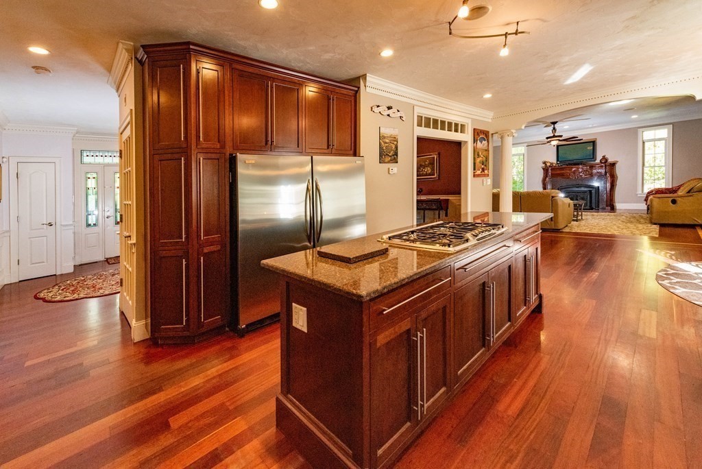 63 Bridge Street Raynham, MA 02767 - Photo 12 of 38 a kitchen with stainless steel appliances granite countertop a stove and a refrigerator