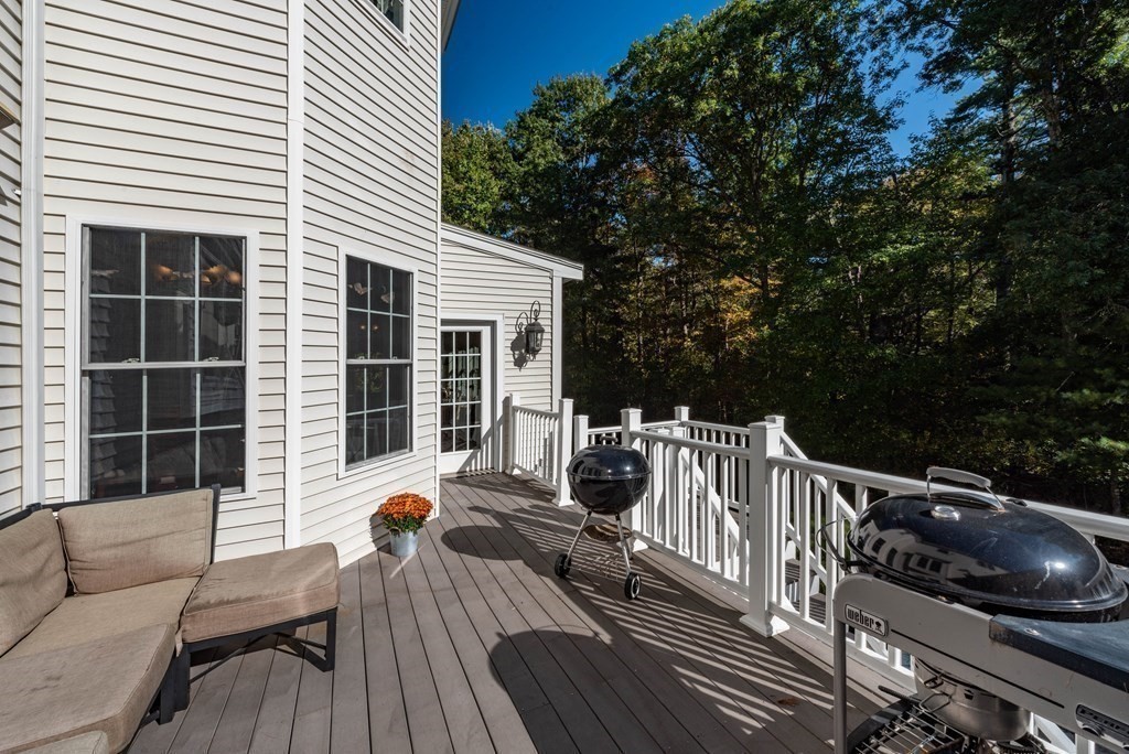 63 Bridge Street Raynham, MA 02767 - Photo 19 of 38 a view of a chair and tables in the balcony