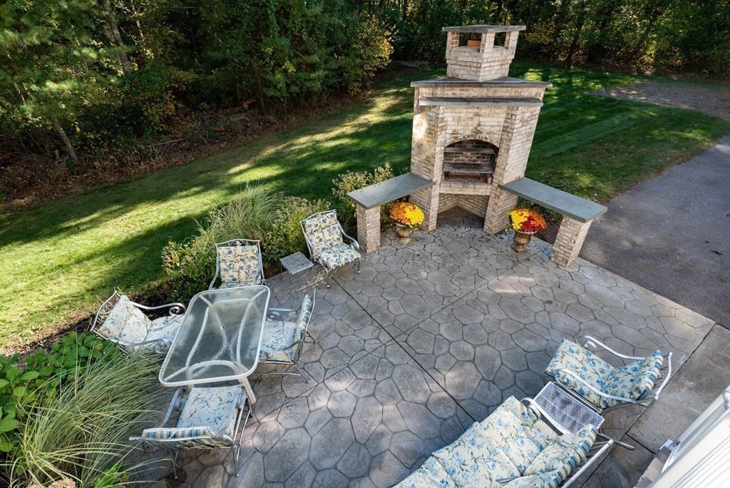 63 Bridge Street Raynham, MA 02767 - Photo 20 of 38 an aerial view of a house with a yard patio and fire pit