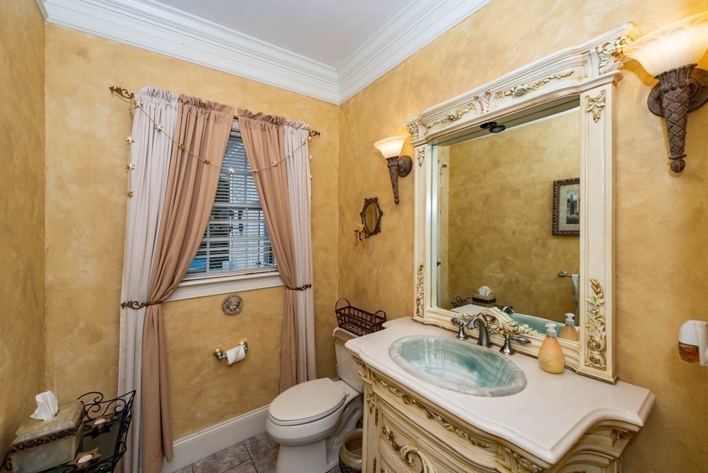 63 Bridge Street Raynham, MA 02767 - Photo 21 of 38 a bathroom with a sink toilet tub and shower