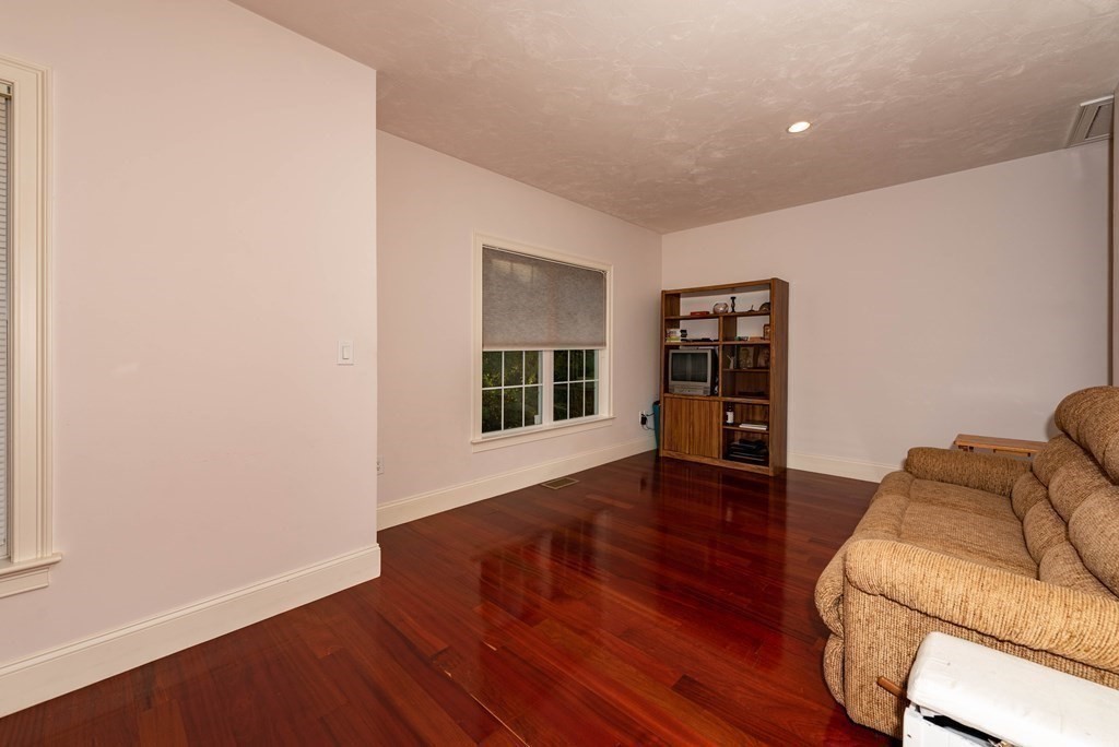63 Bridge Street Raynham, MA 02767 - Photo 24 of 38 a living room with furniture and a wooden floor