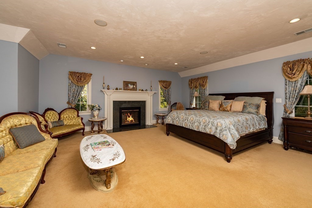 63 Bridge Street Raynham, MA 02767 - Photo 31 of 38 a bedroom with a bed and a couch