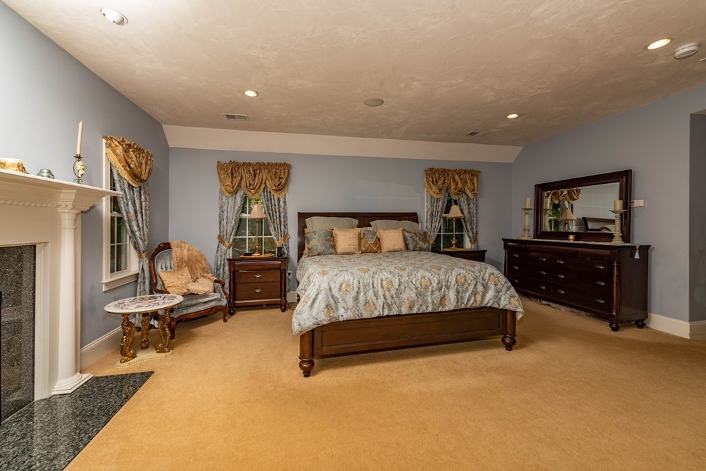 63 Bridge Street Raynham, MA 02767 - Photo 32 of 38 a bedroom with a bed and furniture