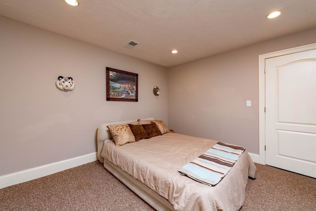 63 Bridge Street Raynham, MA 02767 - Photo 38 of 38 a bedroom with a bed and a window