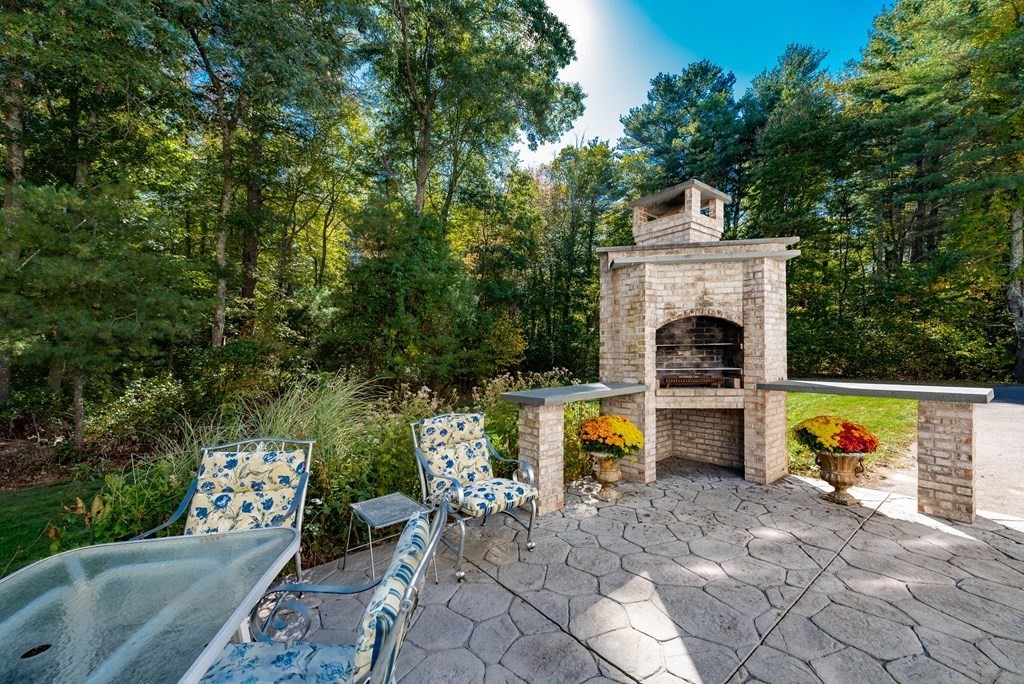 63 Bridge Street Raynham, MA 02767 - Photo 4 of 38 a view of a couch sitting in backyard of house