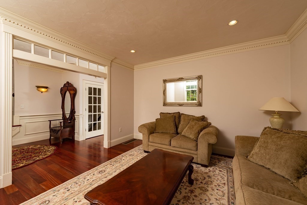 63 Bridge Street Raynham, MA 02767 - Photo 9 of 38 a living room with furniture and a wooden floor