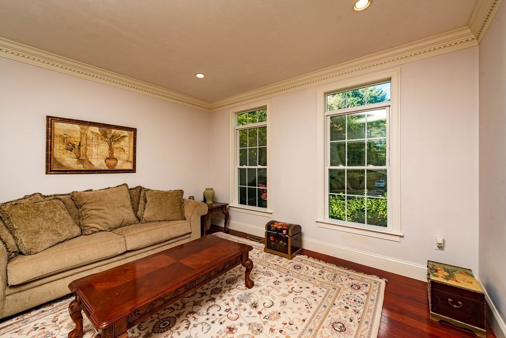 63 Bridge Street Raynham, MA 02767 - Photo 10 of 38 a living room with furniture and a window