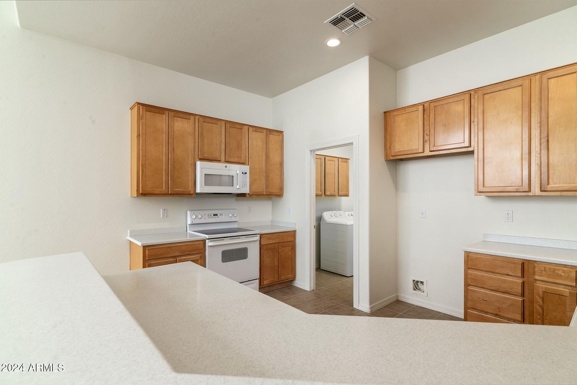 10169 East Dinosaur Ridge Road Gold Canyon, AZ 85118 - Photo 15 of 43 Kitchen and laundry room