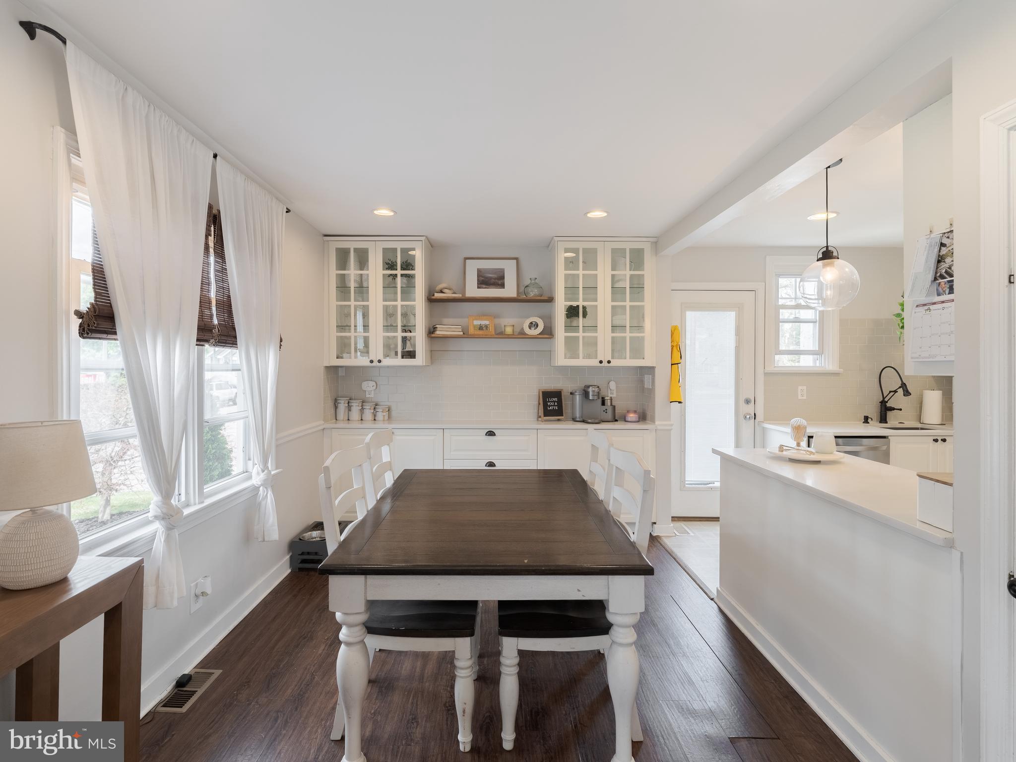 239 Hamel Avenue Glenside, PA 19038 - Photo 12 of 38 a kitchen with a table chairs stove and cabinets