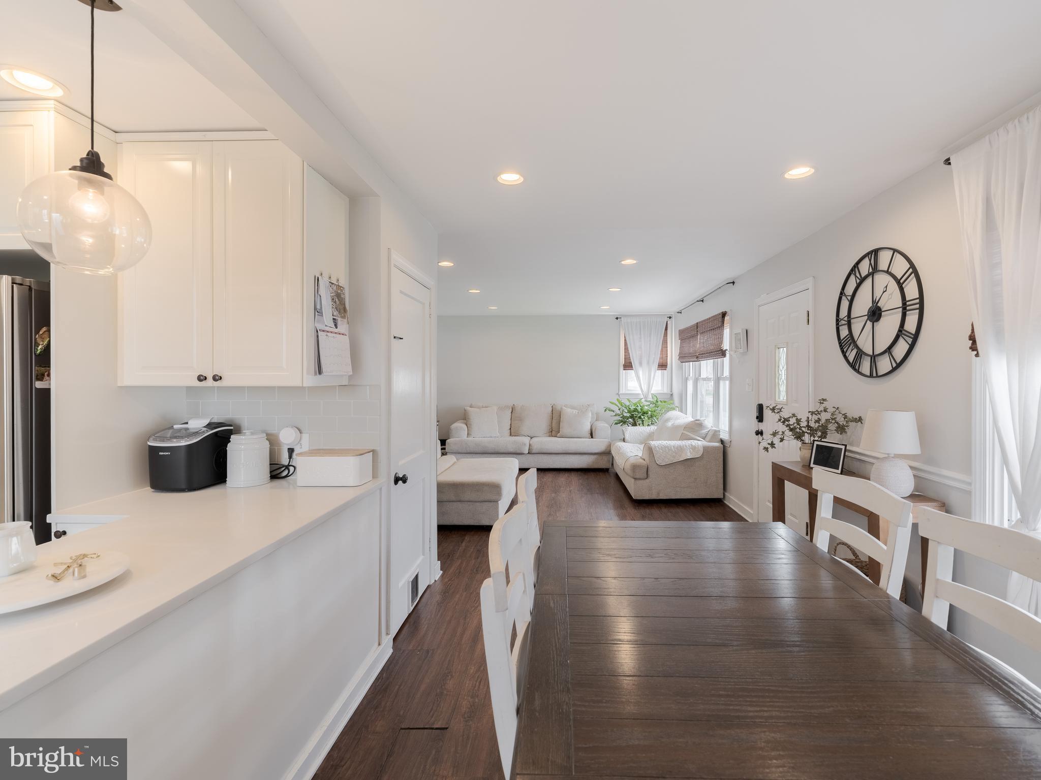 239 Hamel Avenue Glenside, PA 19038 - Photo 14 of 38 a living room with furniture a clock and a view of kitchen