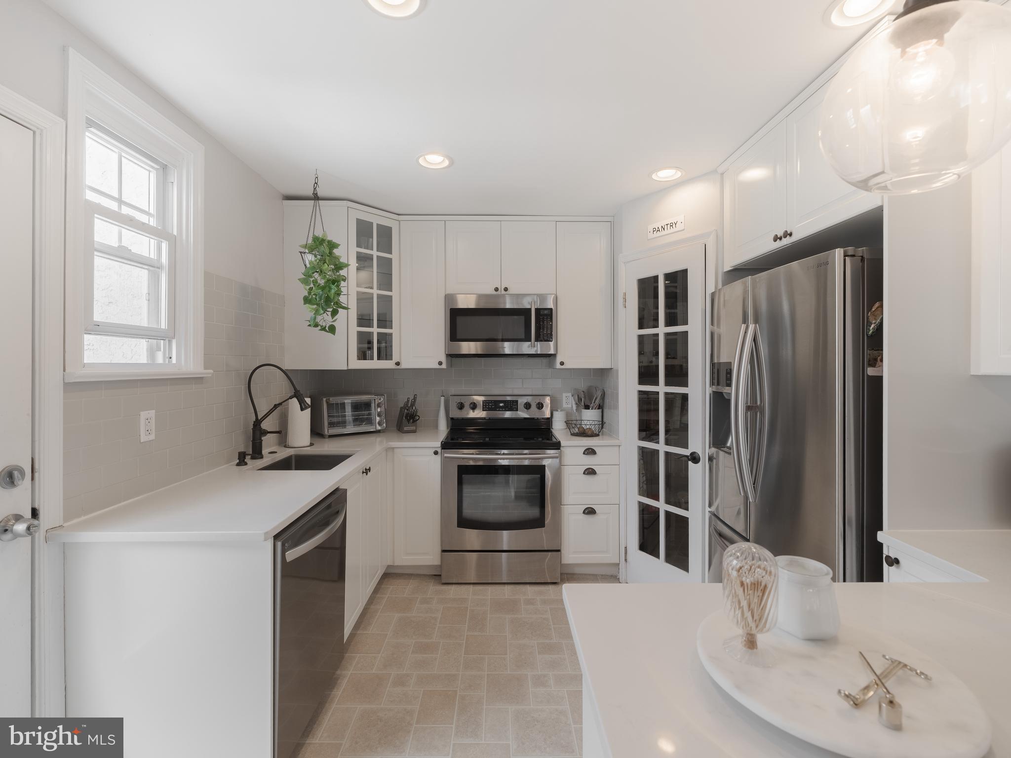 239 Hamel Avenue Glenside, PA 19038 - Photo 15 of 38 a kitchen with a refrigerator stove and sink