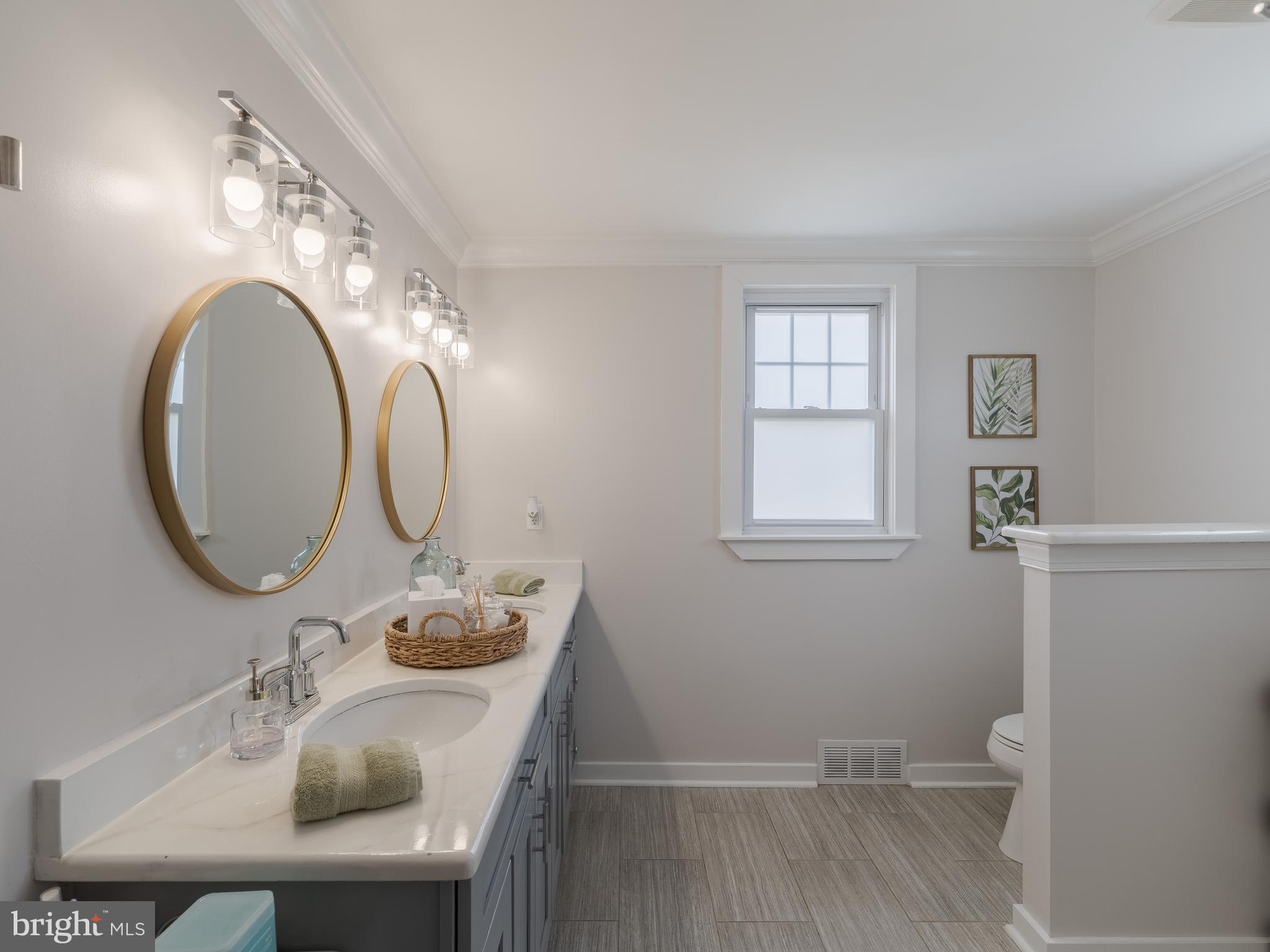 239 Hamel Avenue Glenside, PA 19038 - Photo 24 of 38 a bathroom with a sink and a mirror