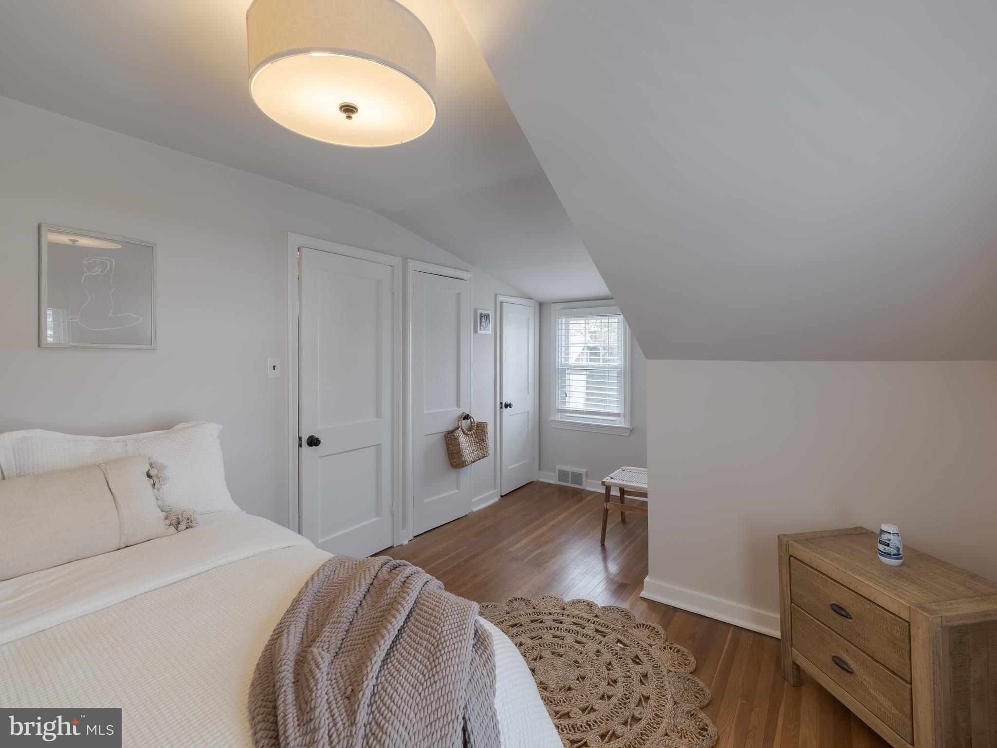 239 Hamel Avenue Glenside, PA 19038 - Photo 33 of 38 a bedroom with a bed and a chandelier