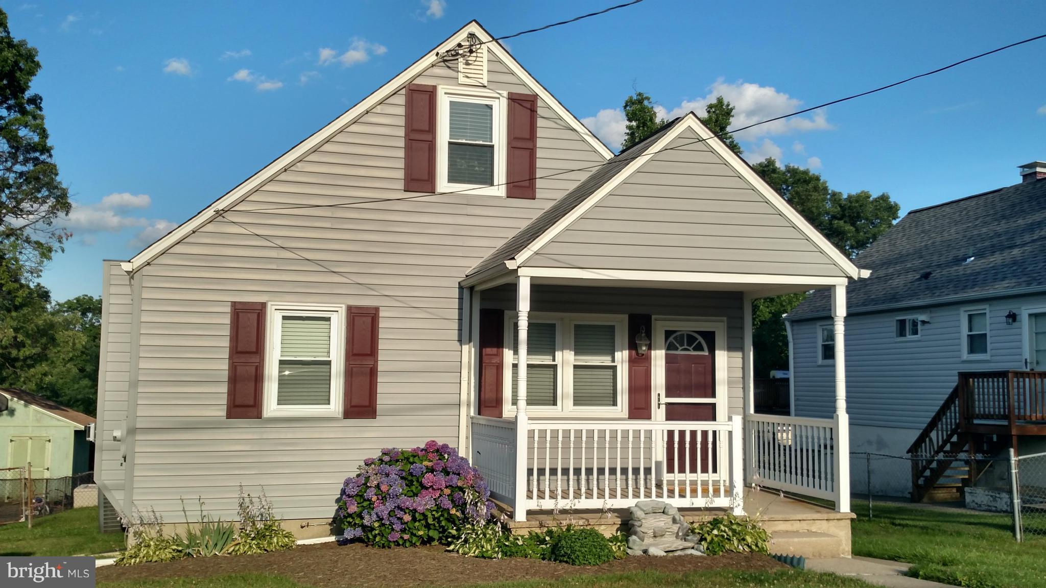 8107 Bon Air Road Baltimore, MD 21234 - Photo 1 of 30 a front view of a house with a porch