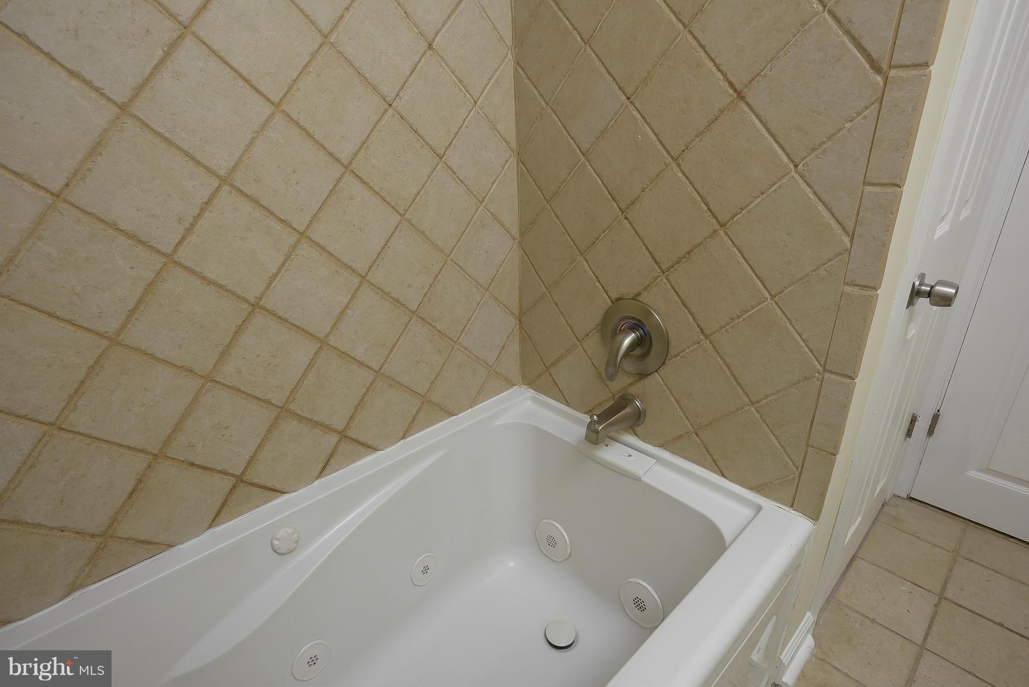 8107 Bon Air Road Baltimore, MD 21234 - Photo 13 of 30 a bathroom with a bathtub