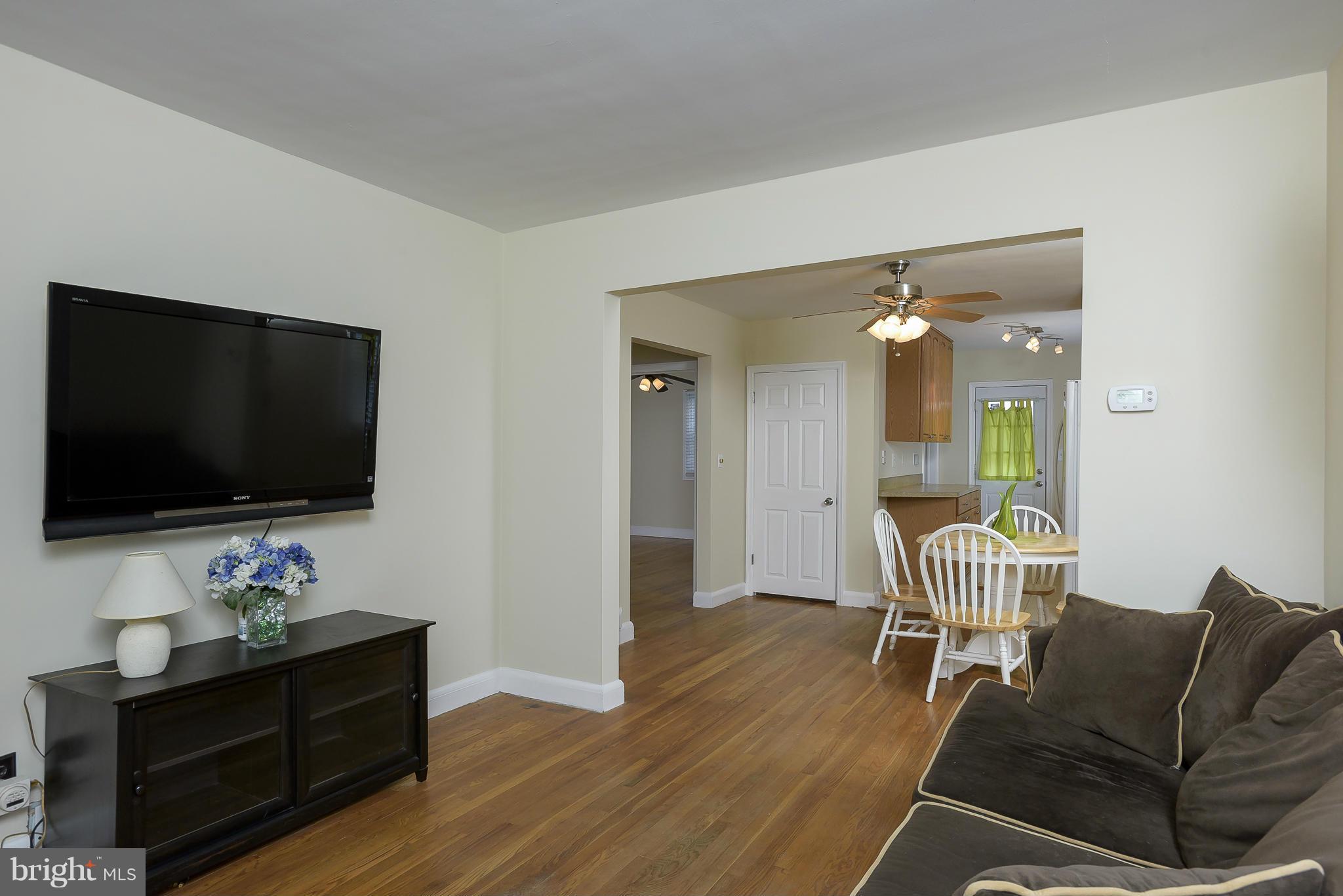 8107 Bon Air Road Baltimore, MD 21234 - Photo 30 of 30 a living room with furniture and a flat screen tv
