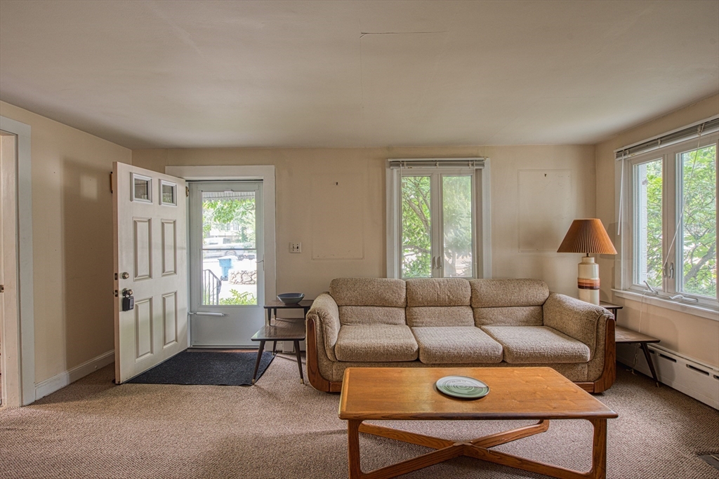 197 Turnpike Street Canton, MA 02021 - Photo 3 of 17 a living room with furniture and a window
