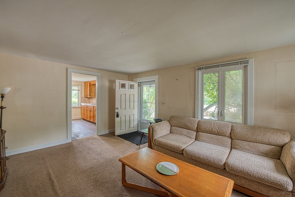 197 Turnpike Street Canton, MA 02021 - Photo 5 of 17 a living room with furniture and a window