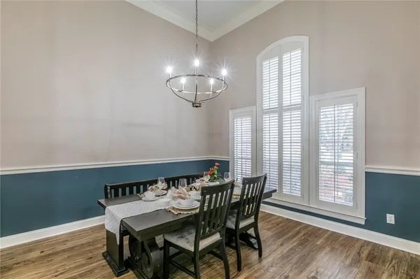 a view of a dining room with furniture and wooden floor