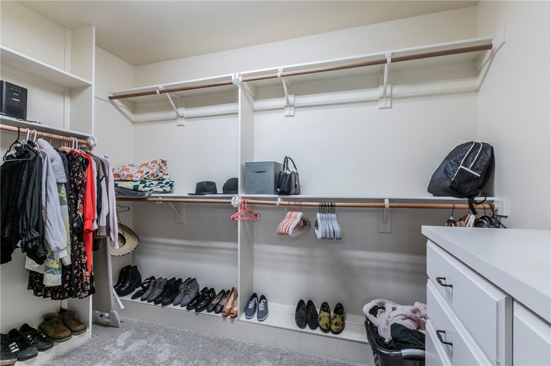 1031 Briar Glen Circle McGregor, TX 76657 - Photo 23 of 41 a view of walk in closet with clothes and shoes