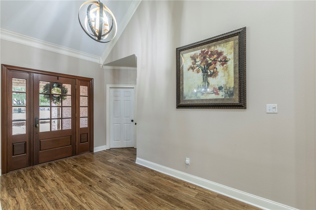 1031 Briar Glen Circle McGregor, TX 76657 - Photo 7 of 41 a view of room with wooden floor and windows