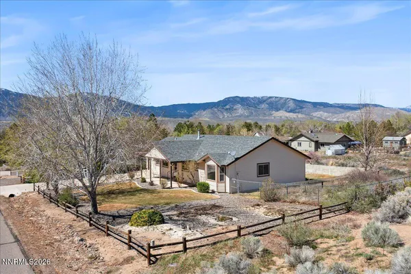 a view of house with a yard