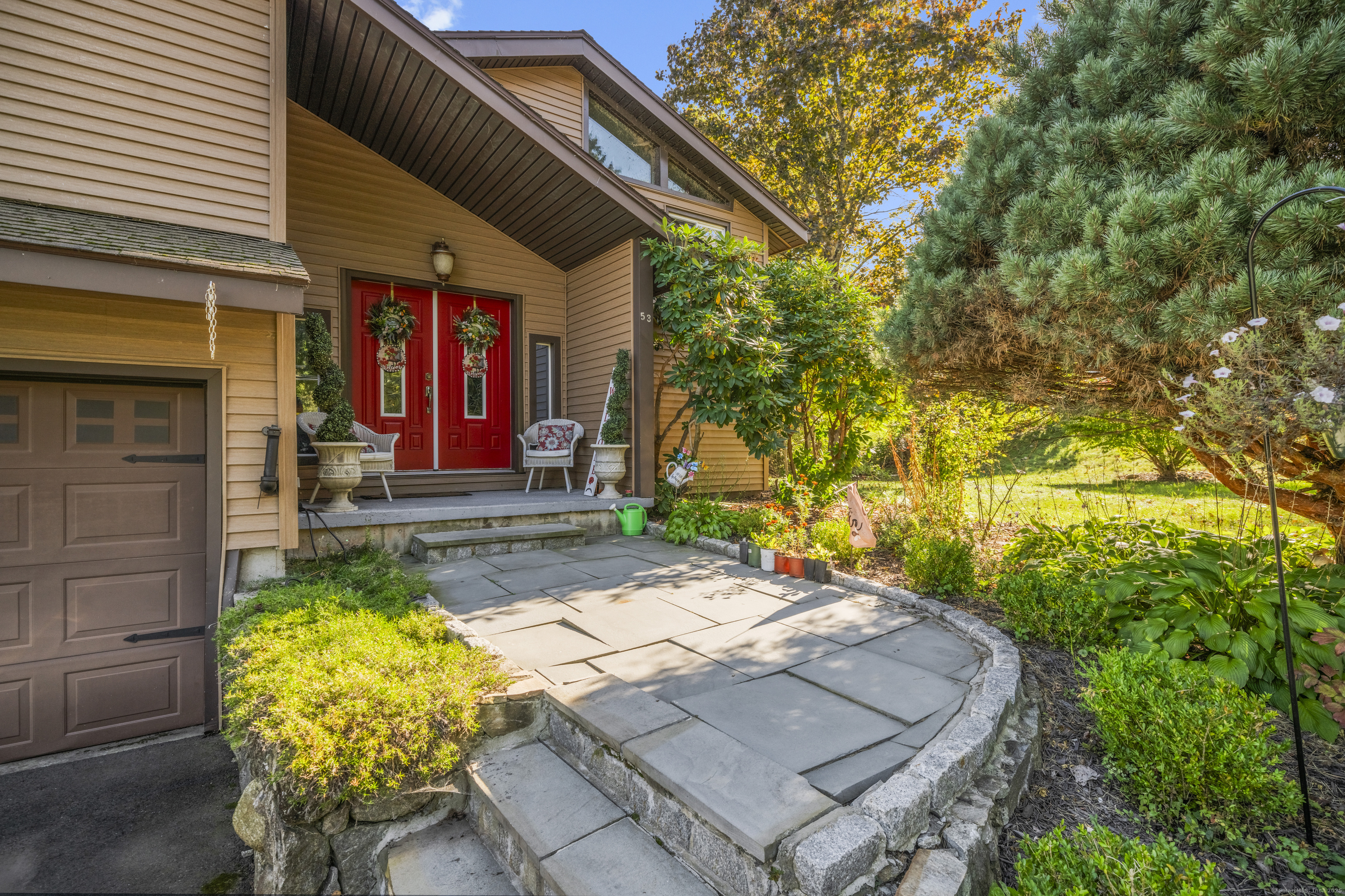 a front view of a house with garden