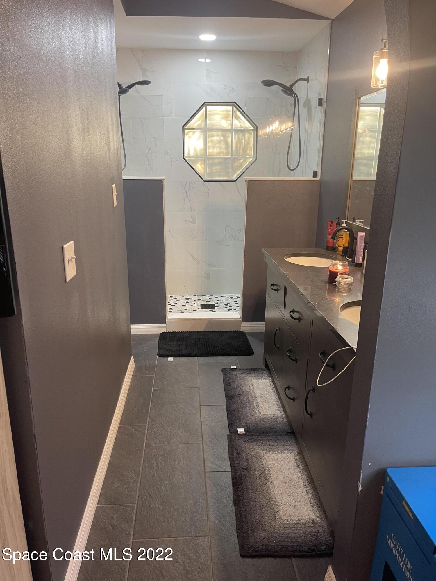 5125 Holden Road Cocoa, FL 32927 - Photo 5 of 6 a view of a hallway with workspace and mirror