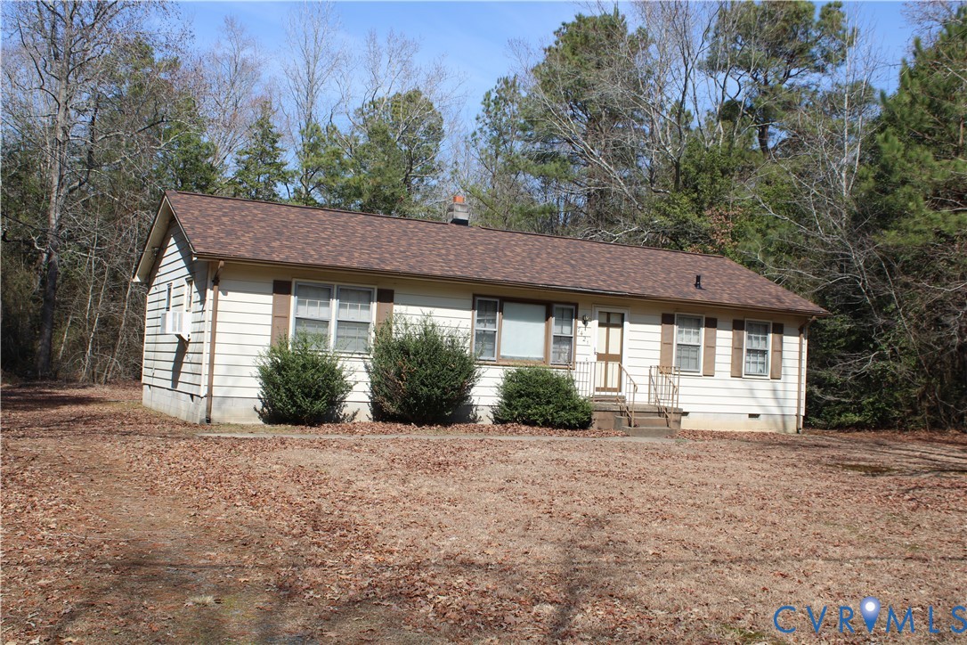 7421 Adkins Road Charles City, VA 23030 - Photo 12 of 14 a view of a house with a yard and potted plants