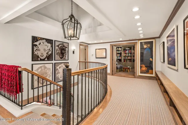 a spacious bedroom with a balcony a bed and a fireplace