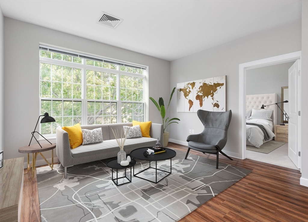 72 Flint, Unit 1307 Salem, MA 01970 - Photo 14 of 14 a living room with furniture and a table