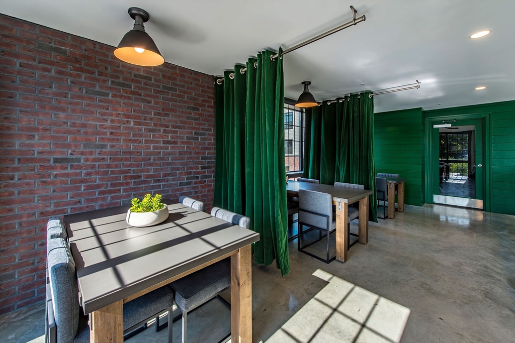 72 Flint, Unit 1307 Salem, MA 01970 - Photo 4 of 14 a view of a dining table and chairs in a patio