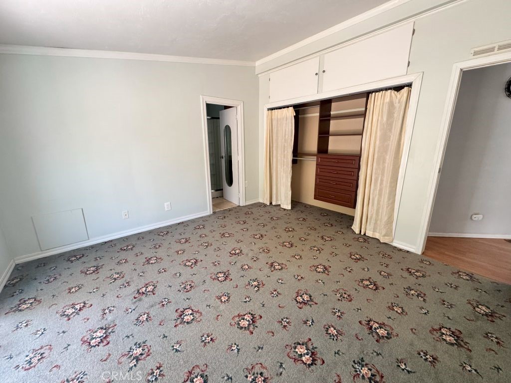 185 Grimont Road Oroville, CA 95966 - Photo 13 of 43 a view of a big room with closet and wooden floor