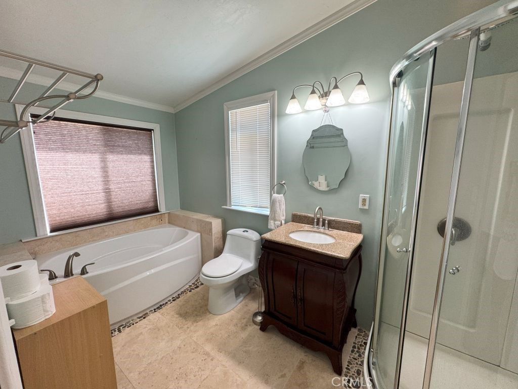 185 Grimont Road Oroville, CA 95966 - Photo 14 of 43 a bathroom with a toilet a sink and a mirror