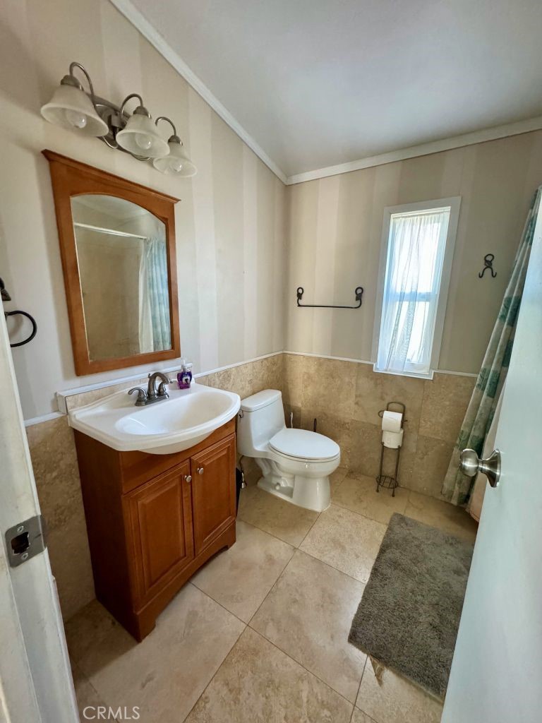 185 Grimont Road Oroville, CA 95966 - Photo 19 of 43 a bathroom with a toilet sink and mirror