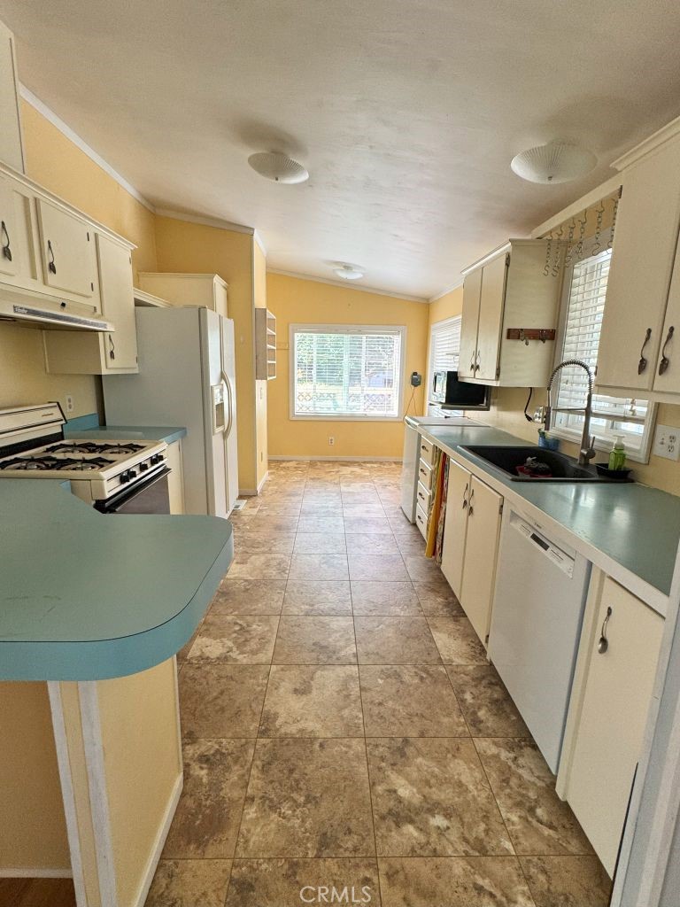 185 Grimont Road Oroville, CA 95966 - Photo 22 of 43 a kitchen with stainless steel appliances granite countertop a sink and cabinets