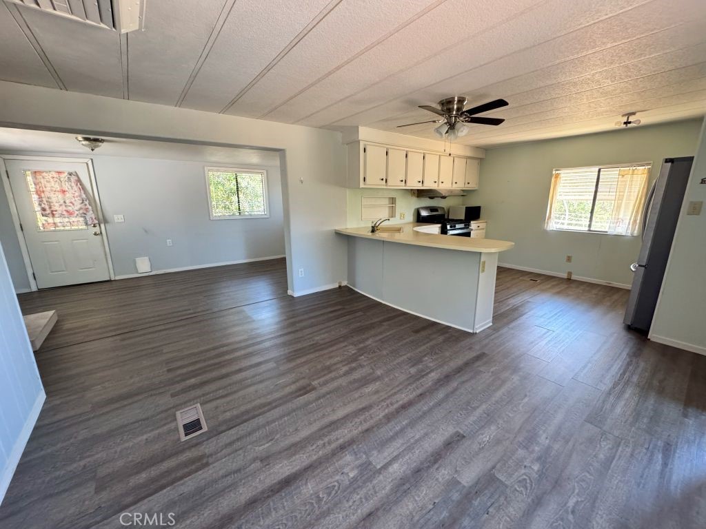 185 Grimont Road Oroville, CA 95966 - Photo 32 of 43 a view of kitchen with sink microwave and window