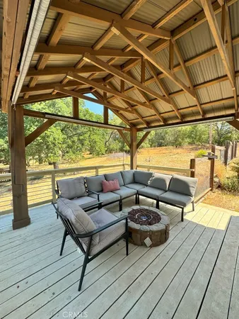 a view of a balcony with wooden floor