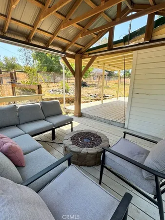 a view of sitting area with furniture on wooden floor