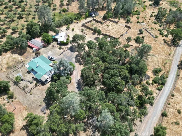 an aerial view of residential house with outdoor space