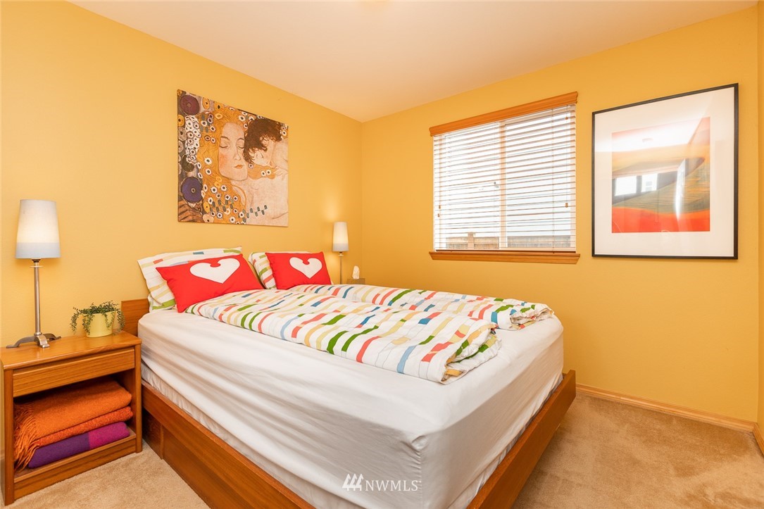 659 Shadow Avenue Northeast Renton, WA 98059 - Photo 13 of 37 a bedroom with a bed and a painting on the wall