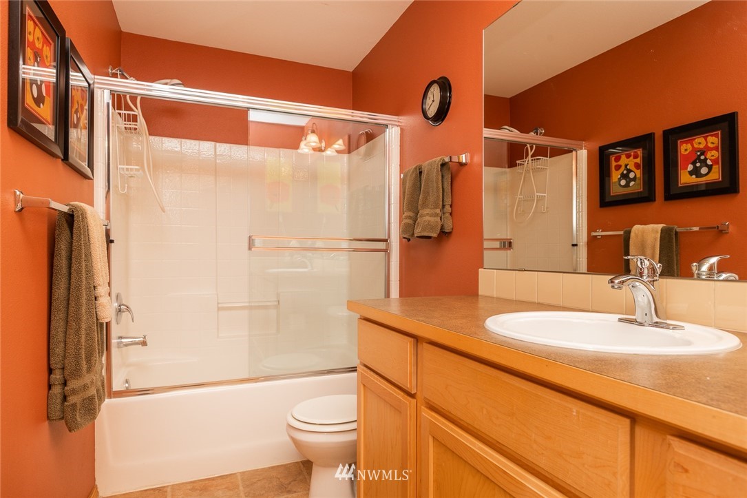 659 Shadow Avenue Northeast Renton, WA 98059 - Photo 14 of 37 a bathroom with a sink a toilet and shower