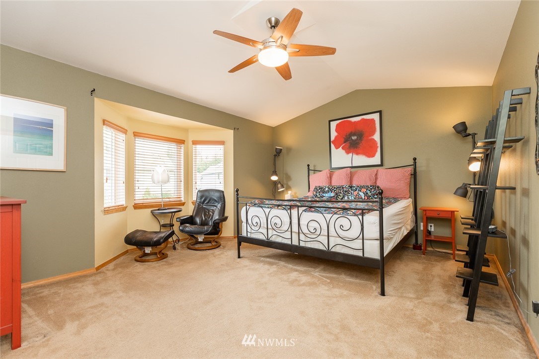 659 Shadow Avenue Northeast Renton, WA 98059 - Photo 17 of 37 a bedroom with furniture window and a ceiling fan