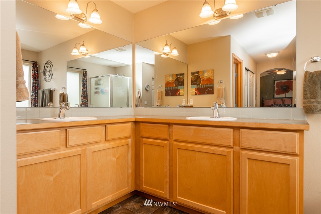 659 Shadow Avenue Northeast Renton, WA 98059 - Photo 21 of 37 a bathroom with a sink and a mirror
